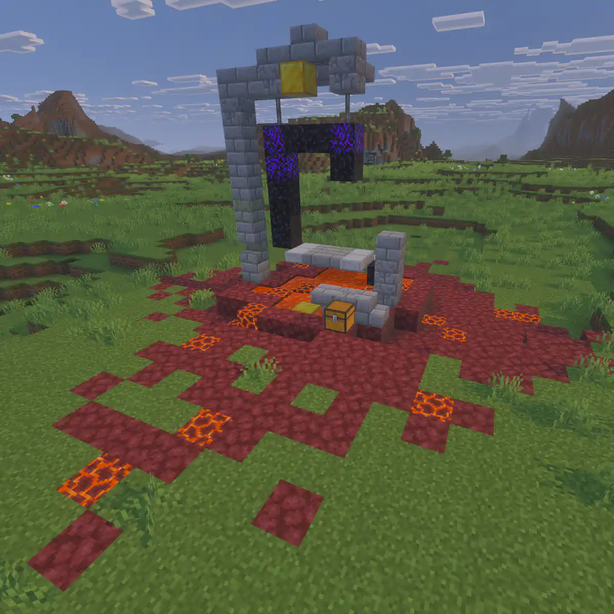 A ruined nether portal of stone bricks and obsidian standing in a grassy plain, surrounded by a scorched patch of netherrack and lava with a chest at its base
