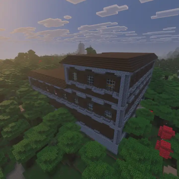A huge dark oak woodland mansion with cobblestone corners, rows of glass windows and a flat brown roof, rising above a thick dark forest with two red mushrooms under a hazy evening sky