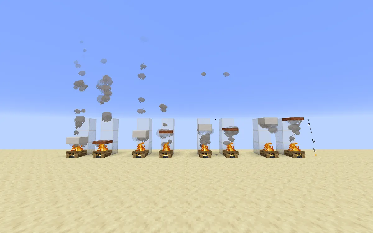 A row of campfires on sand sending grey smoke into a blue sky, some between glass walls and some with blocks placed above them