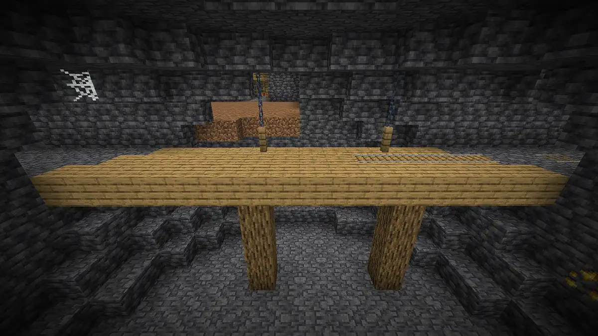 An underground room of deepslate with a wooden platform on two oak log pillars, chains hanging from the ceiling and a cobweb in one corner