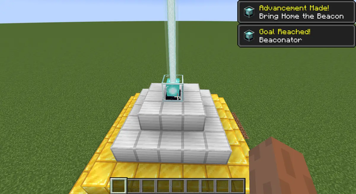 A lit beacon on a pyramid of iron and gold blocks sending a beam into the sky, with the messages Advancement Made! Bring Home the Beacon and Goal Reached! Beaconator in the corner