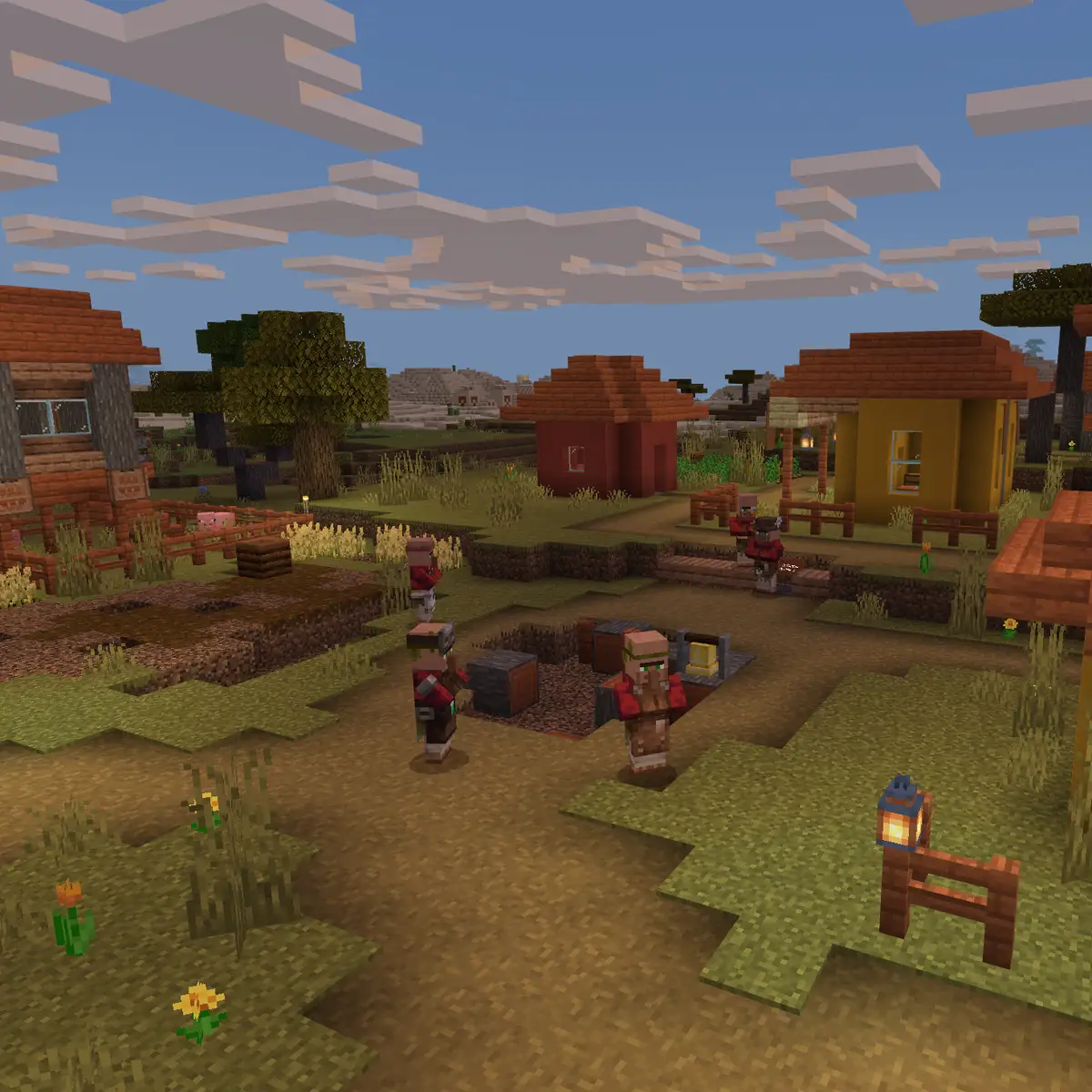 A savanna village in Minecraft with villagers in red and brown robes gathered on a dirt path between orange and yellow houses with sloped roofs, a farm on the left, acacia trees behind and a lantern on a fence post in front